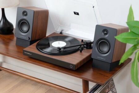 The Victrola Wave on a sideboard with a TEMP Bluetooth speaker